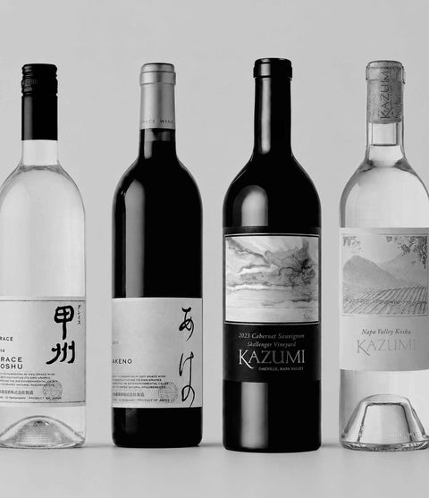 Four Japanese heritage wine bottles with labels on a light gray background