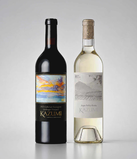 Two bottles of Kazumi wine, one red and one white, on a gray background